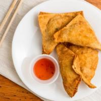 Crab Rangoon · Crab meat, cream cheese and scallion wrapped in wonton skin.