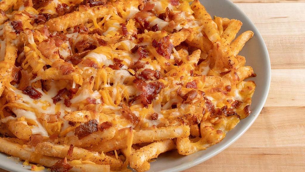 Crib - Seasoned Cheese Fries · Topped with cheese and bacon bits. Served with ranch.