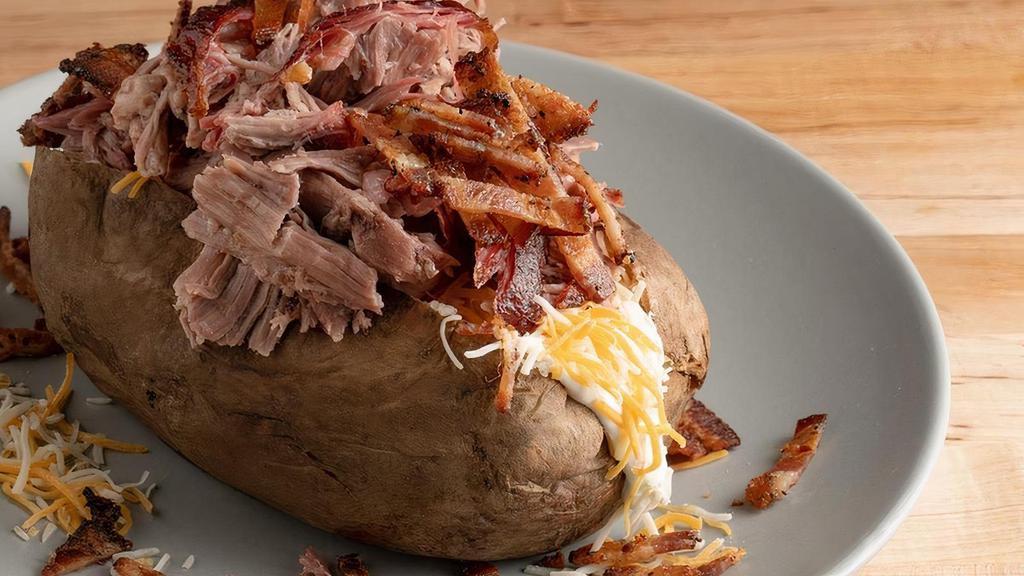 Super Spud · Topped with bacon and your choice of smoked . chicken, pulled pork, or brisket(+2.00) plus . butter, sour cream, and cheddar.