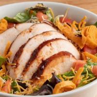 Smoked Chicken Salad · Smoked chicken over fresh greens, topped with tomato, cheese, tortilla strips and your choic...