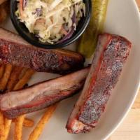 Three Bone · Three St. Louis ribs served with two sides, Texas toast and a pickle.