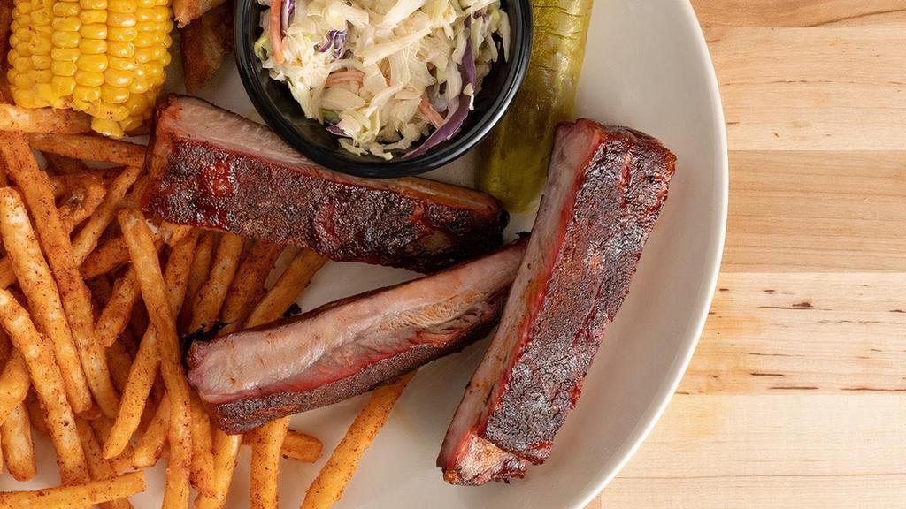 Three Bone · Three St. Louis ribs served with two sides, Texas toast and a pickle.