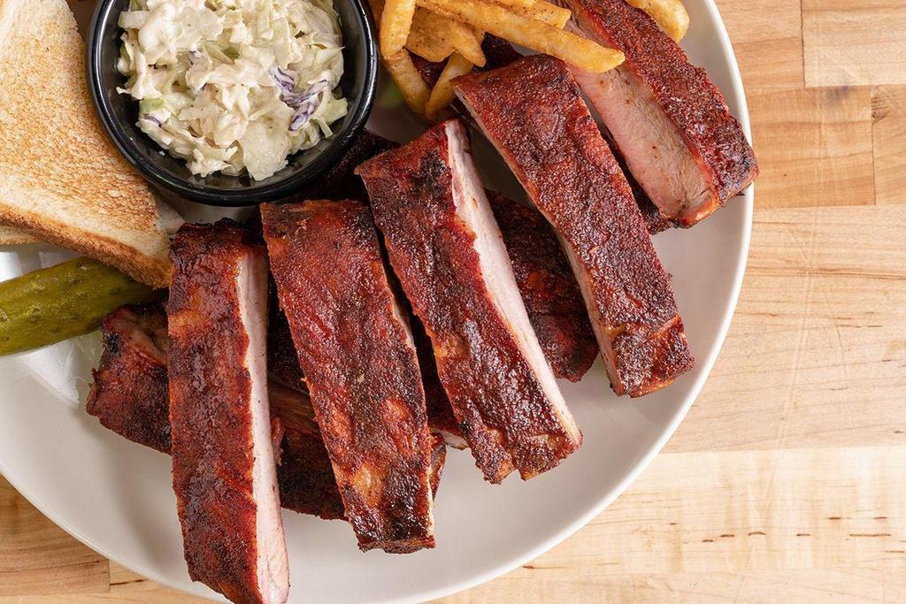 Big Rib Dinner · 10 of our famous ribs, seasoned wtih our signature Righteous Rub, then smoked with split green hickory for hours until tender.
