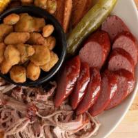 Two Meats · Pick two of our signature smoked meats along with two sides