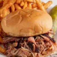 Bbq Sandwich · Your choice of meat piled high on a bun.  Served with one side and a pickle.
