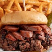Cribwich · A favorite piled with your choice of meat and a hot link on a bun.  Served with one side and...