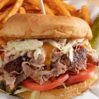 Carolina Pulled Pork · Pulled Pork topped with Cole Slaw, lettuce, tomato and our Carolina mustard sauce on a bun. ...