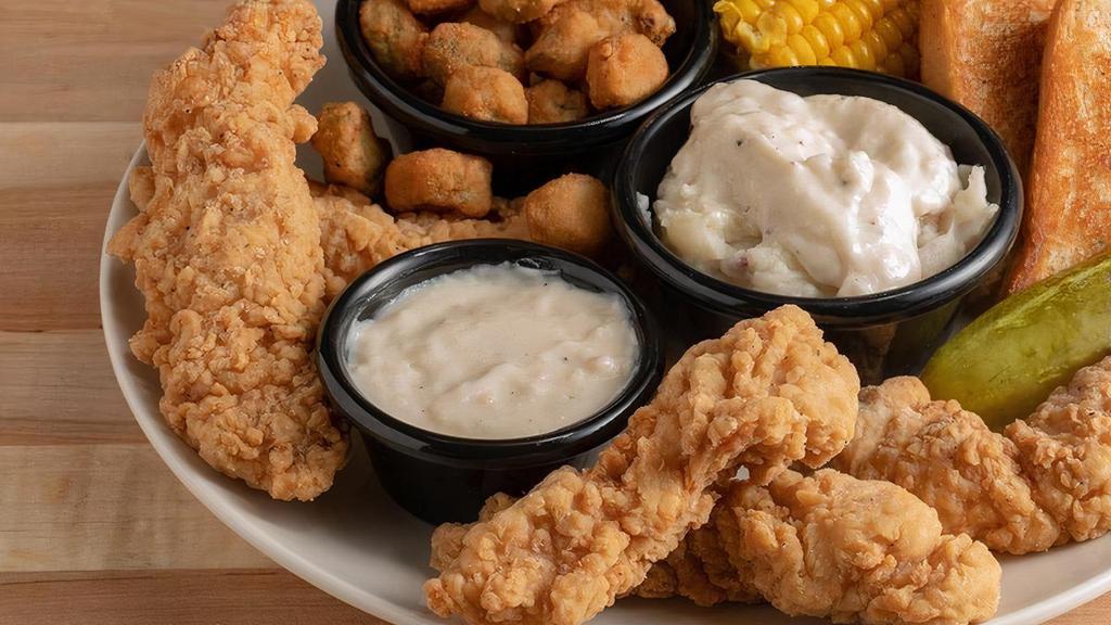 Crispy Chicken Tenders · Fried chicken tenders served with Texas toast, gravy, and two sides.