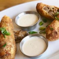 Philly Cheesesteak Egg Rolls · Short rib, provolone, and grilled onions served with horseradish sour cream and ranch.