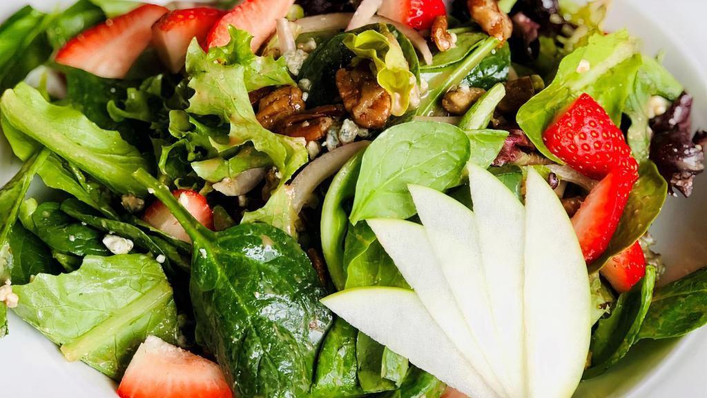 Spring Salad · Spring mix, crumbled bleu cheese, sliced apple, and candied Texas pecans, strawberries, shaved red onion, and served with a balsamic vinaigrette.