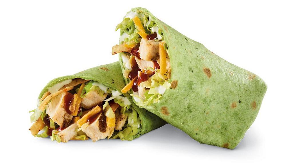 Whiskey River® Bbq Chicken Wrap · Sliced chicken breast, Whisky River® BBQ sauce, Cheddar, lettuce, tortilla strips and ranch in a spinach tortilla.