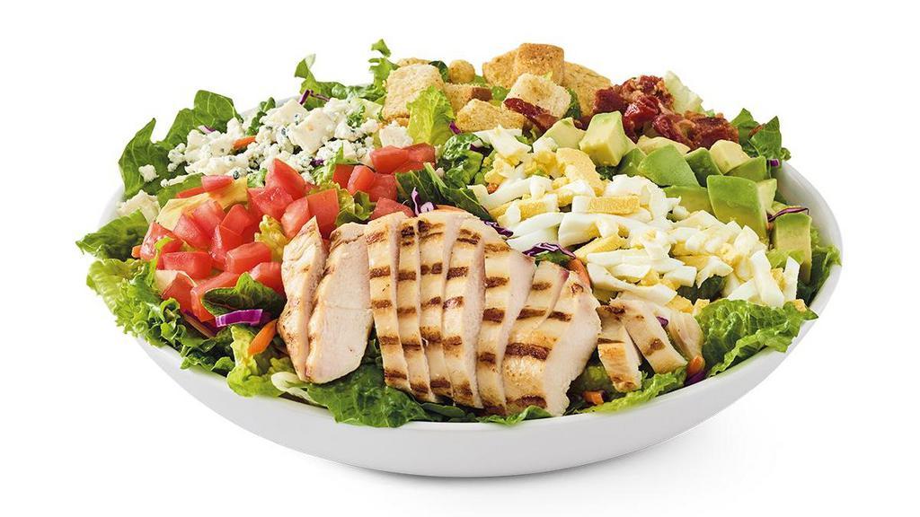 Avo-Cobb-O · Grilled chicken breast, hardwood-smoked bacon, Bleu cheese, hard-boiled egg, tomatoes, croutons, and avocado on mixed greens. Served with choice of dressing.