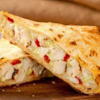 Buffalo Chicken Panini · Grilled chicken, Cheddar Jack cheese, romaine lettuce, bleu cheese dressing, and buffalo win...