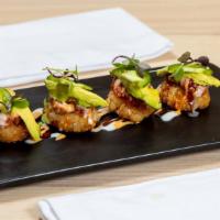 Crispy Rice Spicy Tuna
 · 4 pieces of lightly fried crispy sushi rice topped with spicy tuna, jalapeno, avocado, and s...