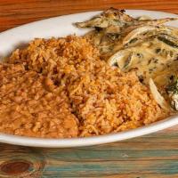 Pollo Poblano · Charbroiled chicken breast topped with a light cream sauce with poblano peppers, onions, and...