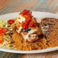 Es Pollo · Charbroiled chicken breast topped with Monterey Jack cheese, grilled onions, ranchero sauce,...