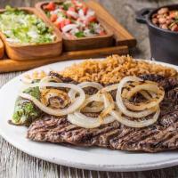 Carne Asada · Marinated skirt steak charbroiled to perfection served with rice, charro beans, pico de gall...