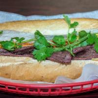Grilled Beef Banh Mi · W/ Mayonaise, Cucumber, Jalapeno, Pickled Carrot and Cilantro.