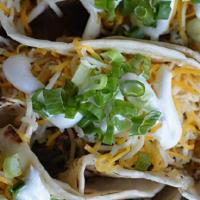 Angus Brisket Or Pulled Pork Tacos · Includes 3 Tacos on Flour Tortilla with Sour Cream , Cheese , and Chives with a Side of your...