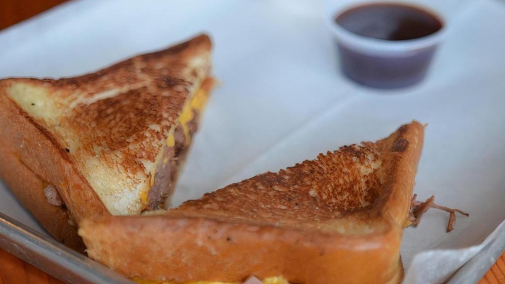 Brisket Grilled Cheese · Texas Toast Stuffed with Melted Cheese & Angus Brisket with a Side of your Choice
