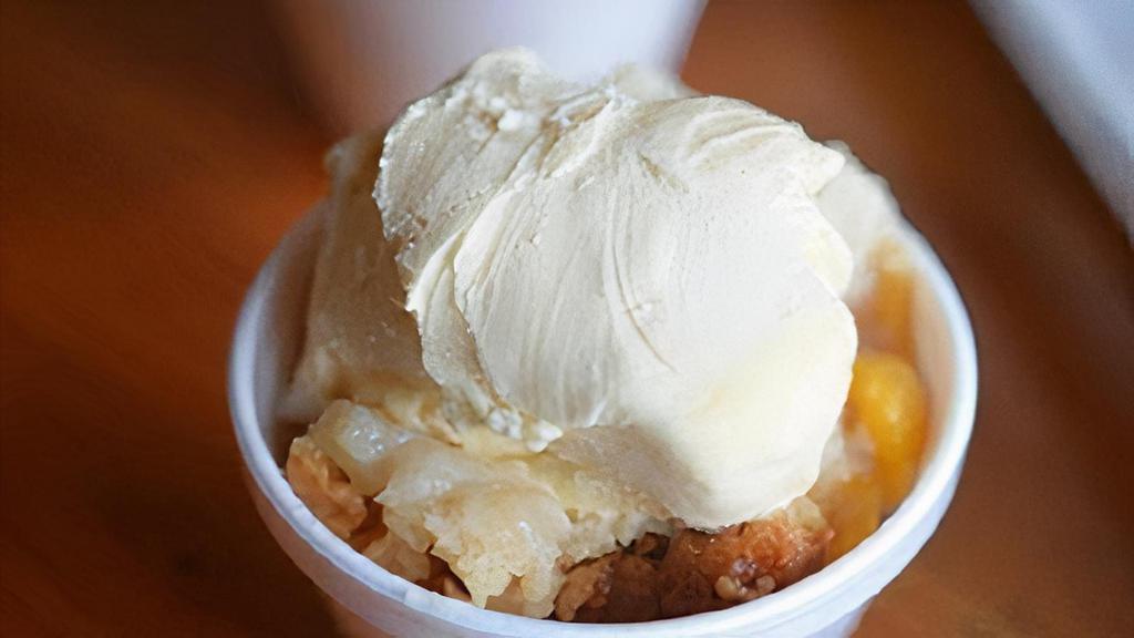 Peach Cobbler · Served with a scoop of ice cream.