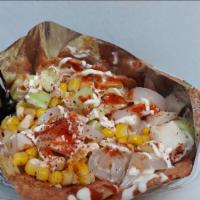 Tostilocos · Enjoy our flavorful totstilocos made with hot corn, cool cucumbers, tasty cueritos, and topp...