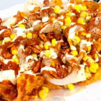 Dorilocos · Doritos loaded with jicama, corn, nacho cheese, valentina, house made chili paste, cueritos,...