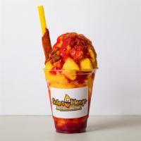 Mangonada · Dressed with red chamoy and lucas then loaded with mango soft shaved Italian ice and topped ...