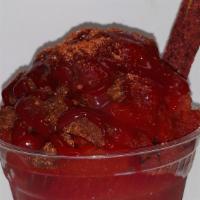 Chamoyada · Dressed with red chamoy and lucas then loaded with chamoy soft shaved Italian ice and topped...