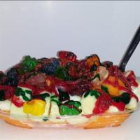 Mango Loco · Frozen mango Italian shaved ice over cucumbers drizzled with red and green chamoy, lucas, gu...