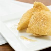 Sopapillas · Fried pastry tossed in powdered sugar-cinnamon with honey