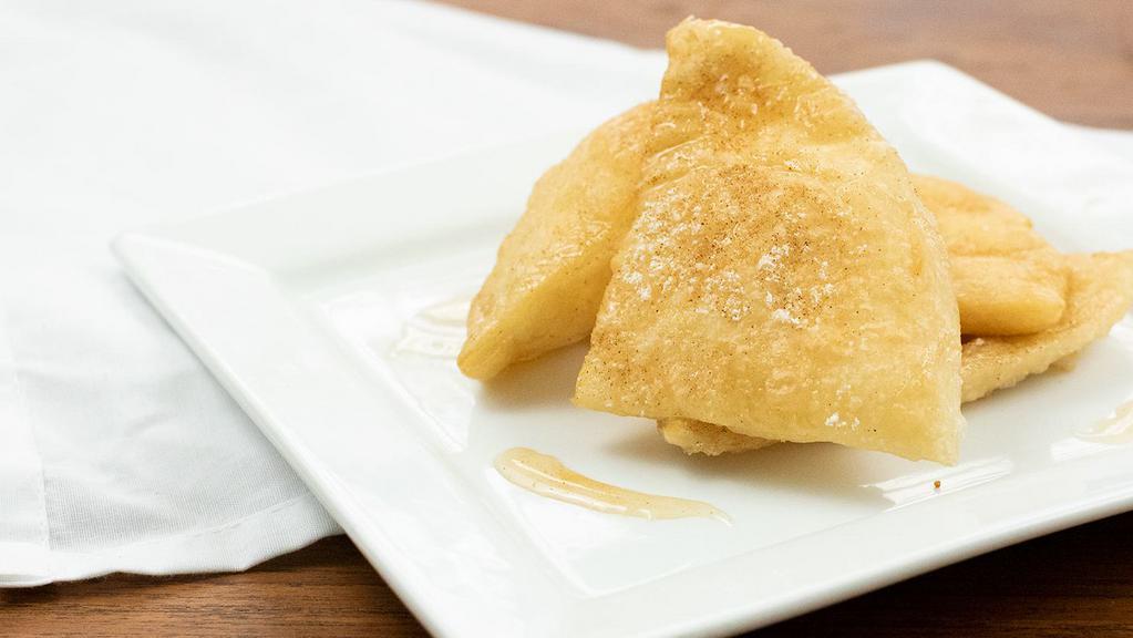 Sopapillas · Fried pastry tossed in powdered sugar-cinnamon with honey