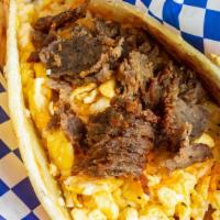 Gyro Egg N Cheese · Beef and lamb gyro meat with eggs and cheese on a flaky Indian tortilla.