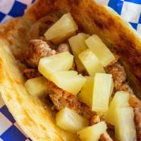 Fiery Caribbean Chicken Taco · Marinated grilled chicken, sautéed onions & jalapeños, pineapples, and our delicious cilantr...