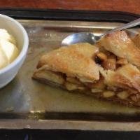 Hot Apple Pie · A large slice of apple pie. Topped with brandy butter and cinnamon ice cream.