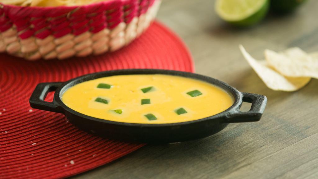 Chile Con Queso (1/2 Pint) · Our special blend prepared with sautéed bell peppers, onions and jalapeños to create the perfect dip.