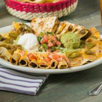 Casa Sampler Platter · Bean nachos, beef nachos, chicken taquitos and beef fajita quesadillas. Served with guacamol...