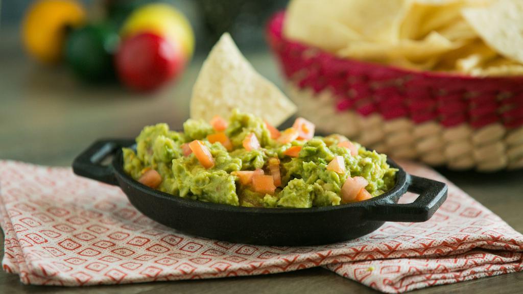 Guacamole (1/2 Pint) · Fresh avocados blended with chopped tomatoes and lime juice. Served on a bed of shredded lettuce.