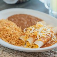 Enchilada Dinner · Three enchiladas topped with your choice of sauce. Served with rice and beans.