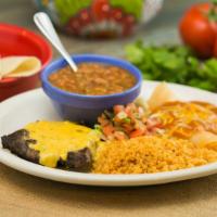 Steak & Enchiladas · A grilled fajita beef steak topped with chile con queso paired with your choice of two enchi...