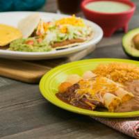 Casa Ole Dinner · A pork tamale topped with chili con carne, two cheese enchiladas with enchilada sauce, a bee...