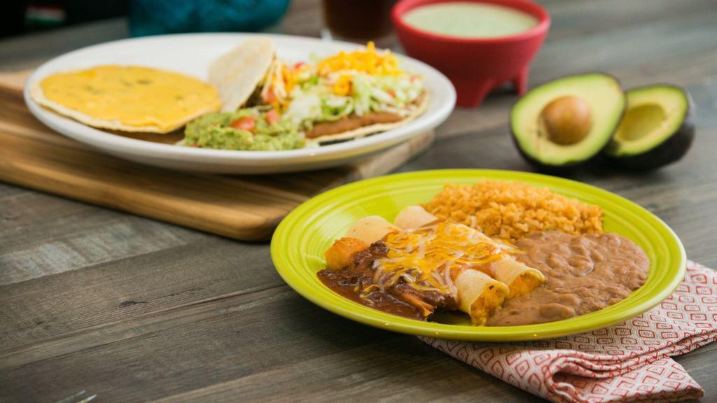Casa Ole Dinner · A pork tamale topped with chili con carne, two cheese enchiladas with enchilada sauce, a beef crispy taco, a bean chalupa, and a chile con queso tostada. Served with guacamole, rice and beans.
