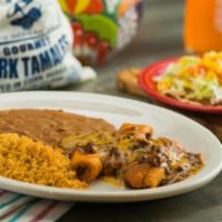 Tamales Ole · Pork tamales topped with chili con carne and shredded cheese, and a bean chalupa. Served wit...