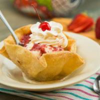 Mexican Sundae · A flour tortilla bowl deep-fried, then filled with vanilla ice cream topped with hot fudge o...