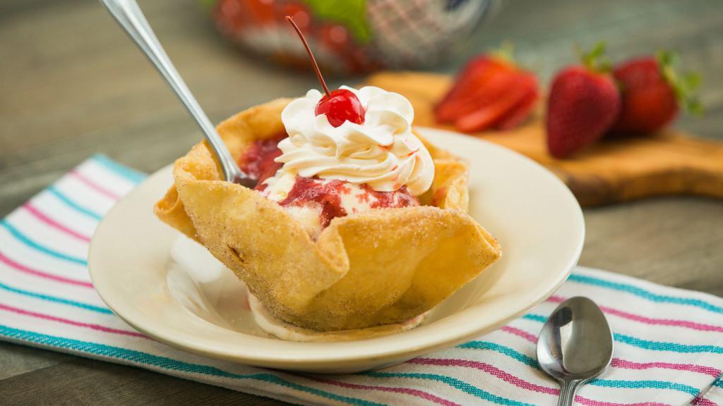 Mexican Sundae · A flour tortilla bowl deep-fried, then filled with vanilla ice cream topped with hot fudge or strawberry sauce, garnished with whipped cream and a cherry on top.