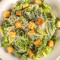 Caesar Salad · Romaine lettuce, parmesan cheese shredded, and croutons.