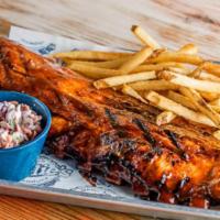 Baby Back Ribs · $18.79 Half Rack / $26.89 Full Rack. Rack of ribs smothered in BBQ sauce served with colesla...