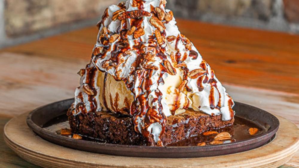 Willie Wonka · Triple chocolate brownie with whip cream, chocolate sauce, pecans, and vanilla ice cream on the side.