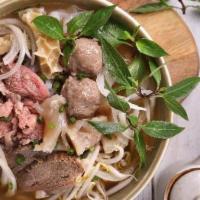 House Special Pho · Vietnamese rice noodle soup combo: rare steak, well-done flanks, meatball, tendon, fatty, an...