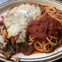 Eggplant Parmigiana · Breaded Eggplant topped with Marinara Sauce and Mozzarella Cheese. Served with a side of spa...